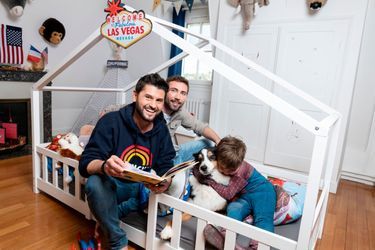 Christophe Beaugrand pose chez lui en compagnie de son mari Ghislain, leur fils Valentin et leur chiuenne Madame. Sevres, FRANCE-03/04/2024